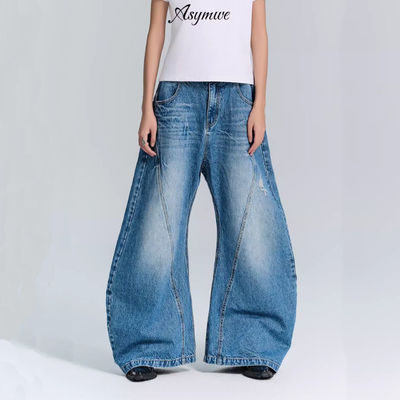 Jeans de pantalones de denim de tejido deconstruido para hombres y mujeres en ropa callejera de talla grande