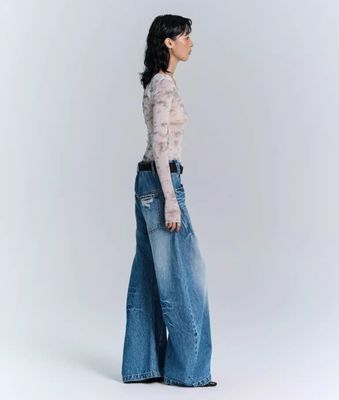 Jeans de pantalones de denim de tejido deconstruido para hombres y mujeres en ropa callejera de talla grande