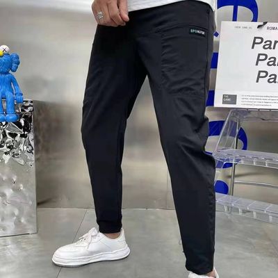 Pantalones de carga masculinos de estilo frontal plano en stock con botones personalizados Corredores de fitness sueltos