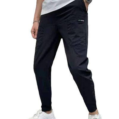 Pantalones de carga masculinos de estilo frontal plano en stock con botones personalizados Corredores de fitness sueltos
