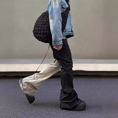 Mediana cintura Tejido de denim a medida Lavado con bordes crudos Parcheado Pantalones desbordados Jeans para hombres