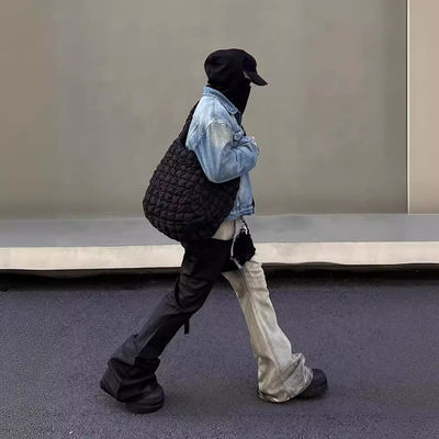 Mediana cintura Tejido de denim a medida Lavado con bordes crudos Parcheado Pantalones desbordados Jeans para hombres